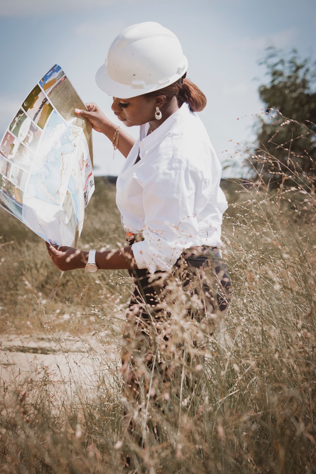 Engineer reviewing site plans during a field inspection