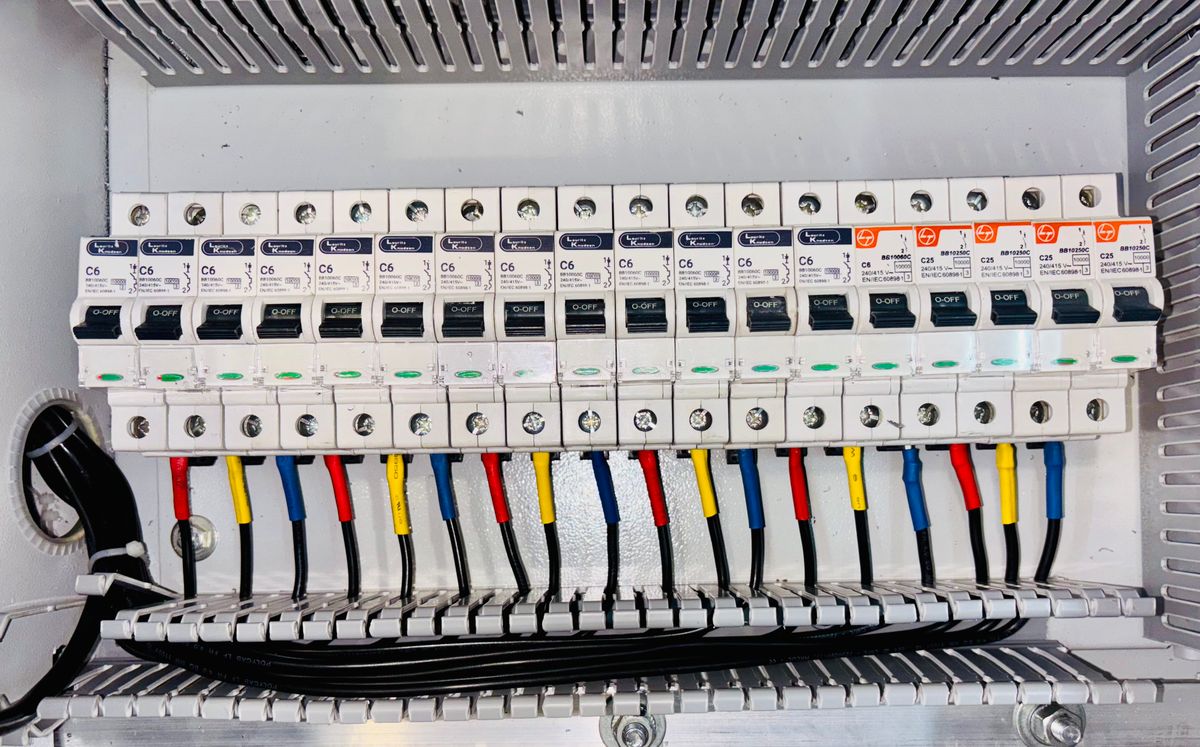 Close-up of color-coded electrical panel wiring