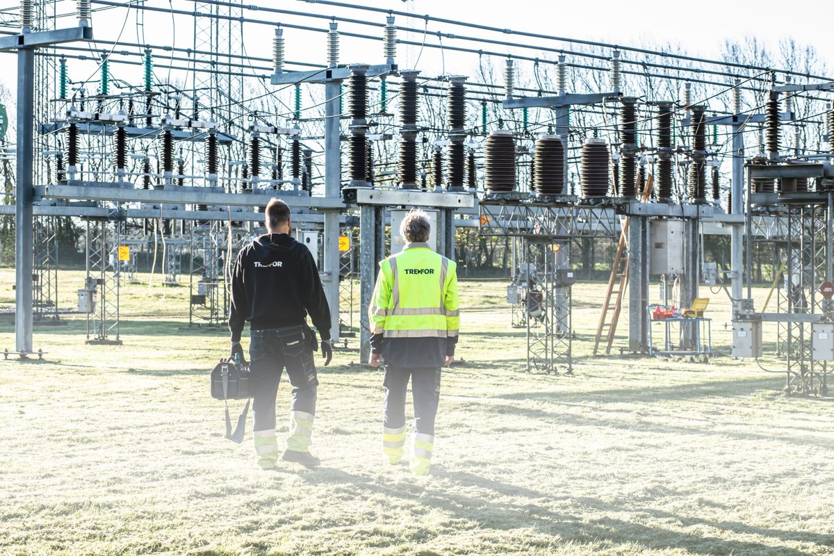 Technicians at an electrical transformer substation